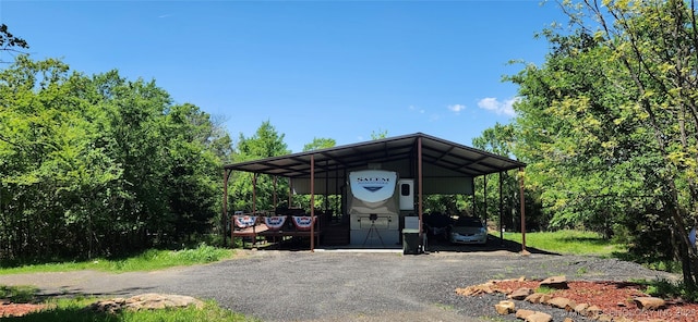 view of vehicle parking featuring a detached carport