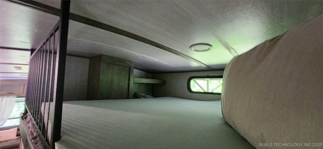 bonus room featuring vaulted ceiling and carpet flooring