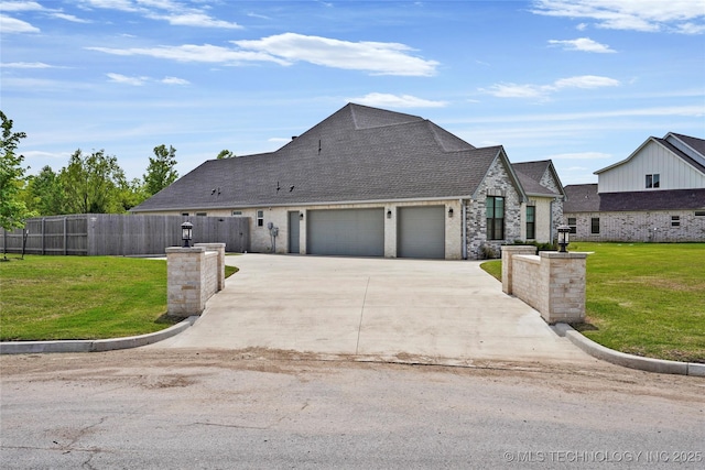 15916 E 106th Pl, Owasso, OK 74055 - view of front of property featuring a garage, fence, driveway, a front yard, and roof with shingles