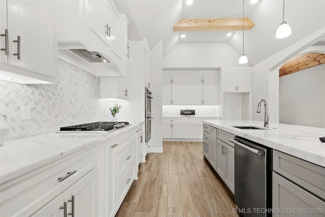 15916 E 106th Pl, Owasso, OK 74055 - kitchen featuring light wood-style flooring, a sink, appliances with stainless steel finishes, decorative backsplash, and light stone counters