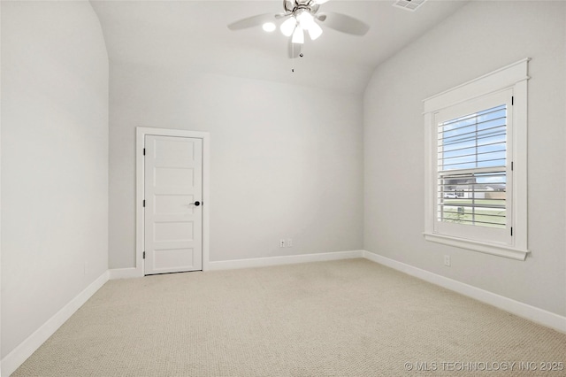 15916 E 106th Pl, Owasso, OK 74055 - spare room featuring baseboards, lofted ceiling, ceiling fan, and light colored carpet