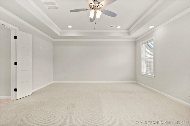 15916 E 106th Pl, Owasso, OK 74055 - spare room with a ceiling fan, crown molding, visible vents, a raised ceiling, and light colored carpet