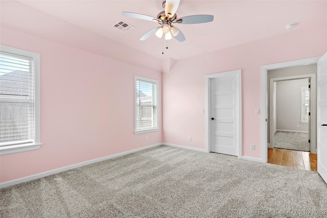 15916 E 106th Pl, Owasso, OK 74055 - unfurnished bedroom with light colored carpet, baseboards, a ceiling fan, and visible vents