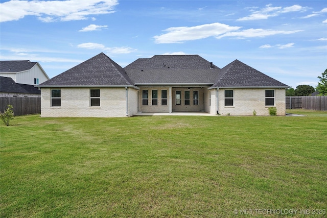 15916 E 106th Pl, Owasso, OK 74055 - rear view of property with a patio area, brick siding, a shingled roof, and a fenced backyard