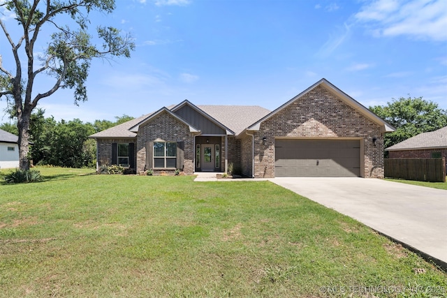543 Edgewood, Durant, OK 74701 - view of front of house with a garage, brick siding, and concrete driveway