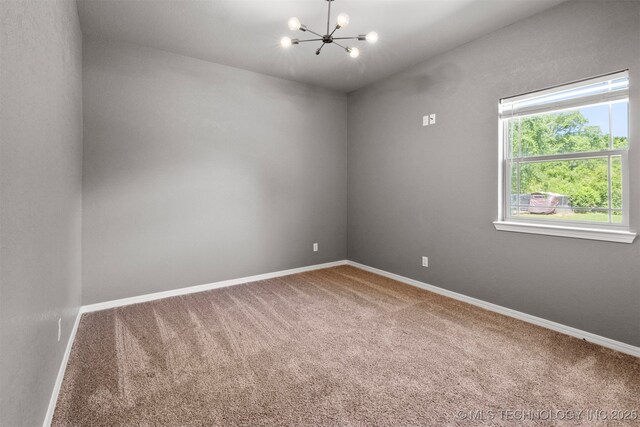 543 Edgewood, Durant, OK 74701 - unfurnished room featuring carpet floors, a chandelier, and baseboards