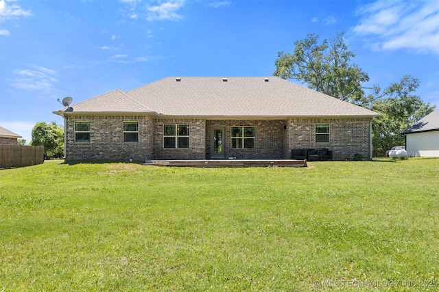 543 Edgewood, Durant, OK 74701 - rear view of property featuring brick siding and roof with shingles