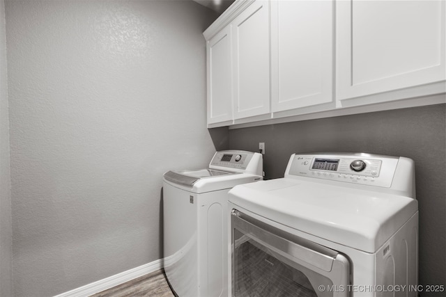 543 Edgewood, Durant, OK 74701 - washroom featuring cabinet space, washer and clothes dryer, a textured wall, and baseboards