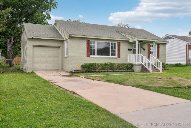 view of front of property featuring roof with shingles, an attached garage, a front lawn, brick siding, and driveway