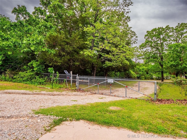 view of community featuring fence and a gate