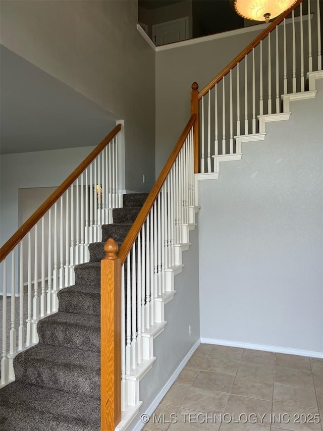 stairs featuring baseboards