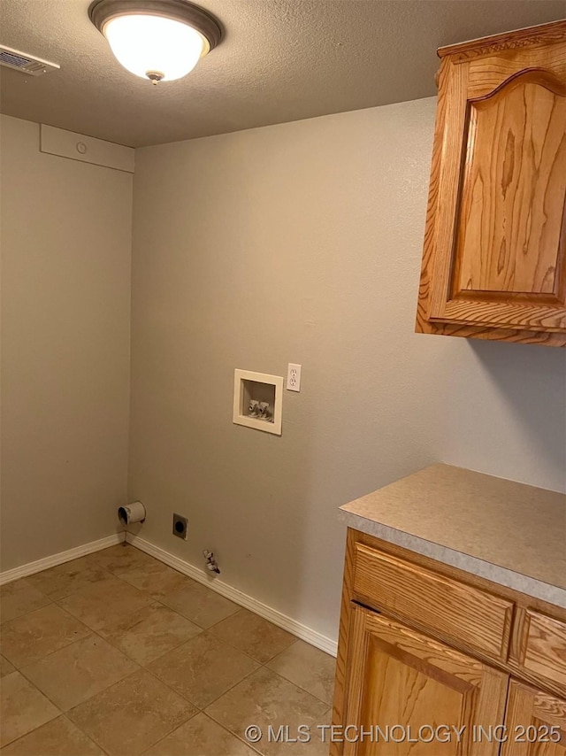 laundry area featuring cabinet space, washer hookup, gas dryer hookup, hookup for an electric dryer, and visible vents