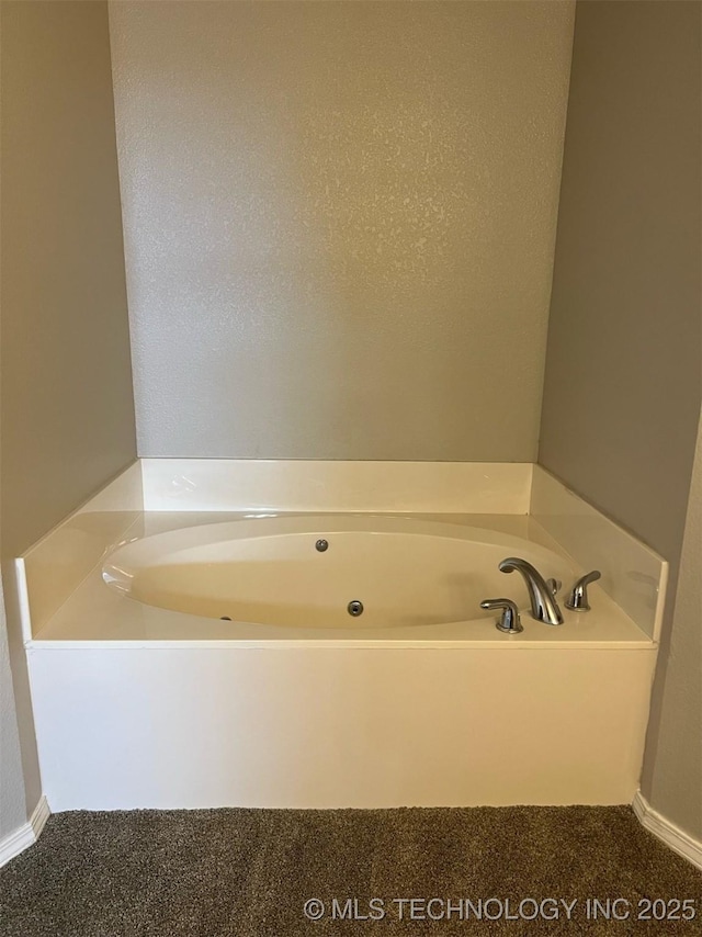 bathroom with a garden tub