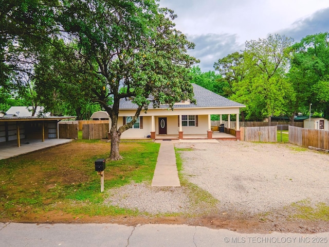 711 W Denton Ave, Sallisaw, OK 74955 - view of front of property with covered porch, fence, and gravel driveway