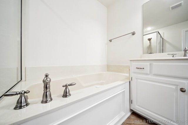 bathroom with a bath and vanity