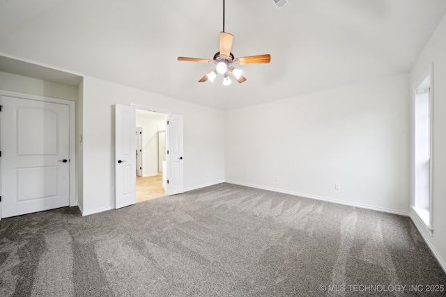 unfurnished bedroom with carpet floors, baseboards, and a ceiling fan