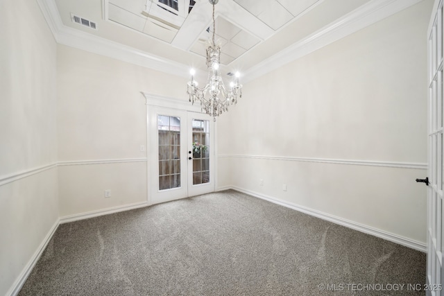 spare room featuring french doors, carpet, a chandelier, crown molding, and baseboards