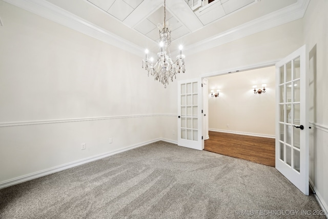 carpeted spare room featuring french doors, ornamental molding, a chandelier, baseboards, and beamed ceiling