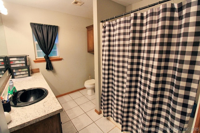 full bath featuring visible vents, vanity, tile patterned floors, baseboards, and toilet
