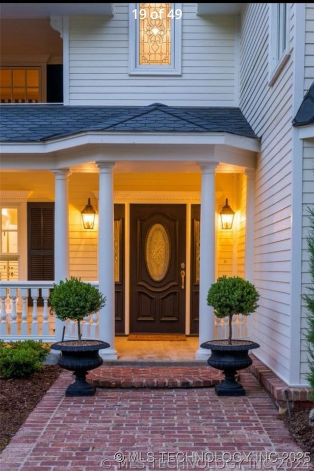 doorway to property featuring a porch