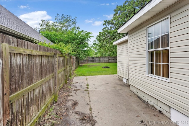exterior space with a lawn, a patio, crawl space, and a fenced backyard