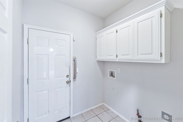 clothes washing area featuring cabinet space, washer hookup, baseboards, electric dryer hookup, and light tile patterned floors