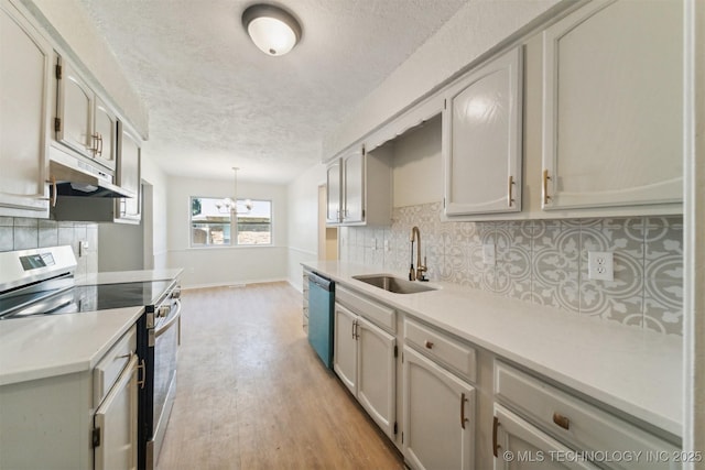 kitchen featuring a sink, dishwasher, a textured ceiling, under cabinet range hood, and stainless steel electric stove