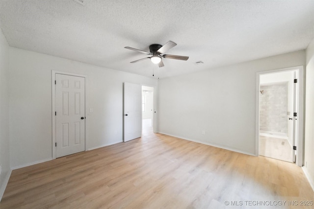unfurnished bedroom with baseboards, light wood-style flooring, and visible vents