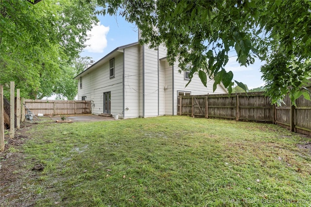 view of yard featuring a fenced backyard and a patio