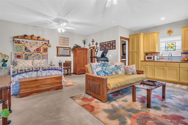 interior space with finished concrete floors, a ceiling fan, an AC wall unit, and recessed lighting
