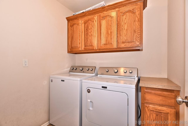 laundry room featuring cabinet space and washing machine and clothes dryer