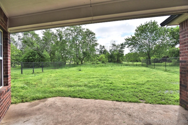 view of yard with fence and a patio area