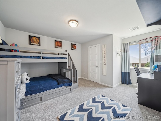 carpeted bedroom featuring baseboards and visible vents