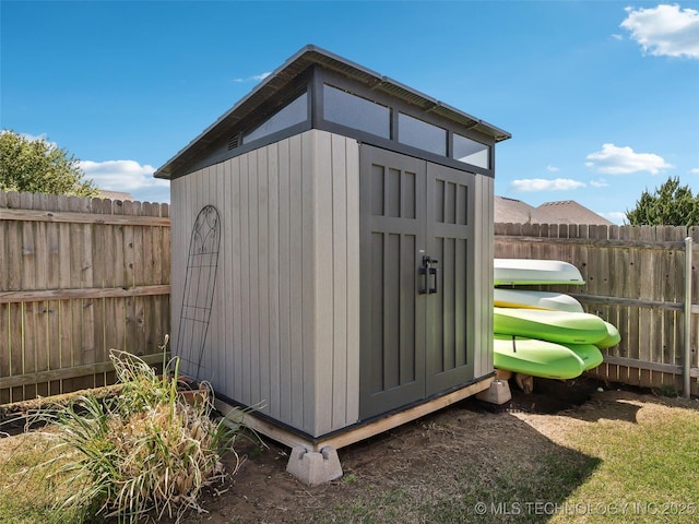 view of shed with a fenced backyard
