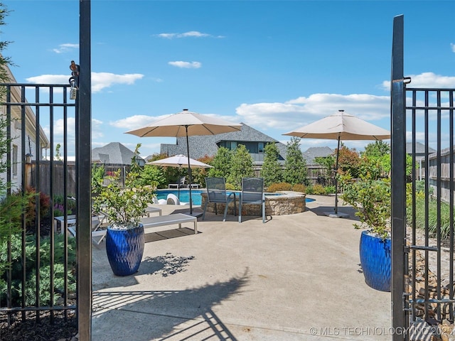 view of patio / terrace with a fenced in pool and a fenced backyard