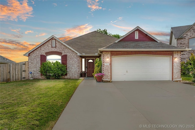 3933 S 199th E Ave, Broken Arrow, OK 74014 - view of front of property with roof with shingles, an attached garage, brick siding, concrete driveway, and a lawn