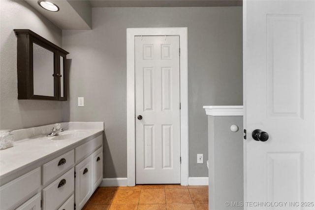 3933 S 199th E Ave, Broken Arrow, OK 74014 - bathroom with baseboards, tile patterned flooring, and vanity