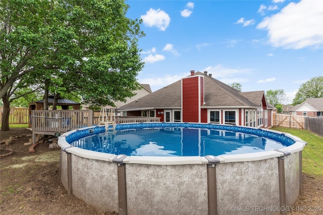 3933 S 199th E Ave, Broken Arrow, OK 74014 - view of pool with a deck, a fenced in pool, and a fenced backyard