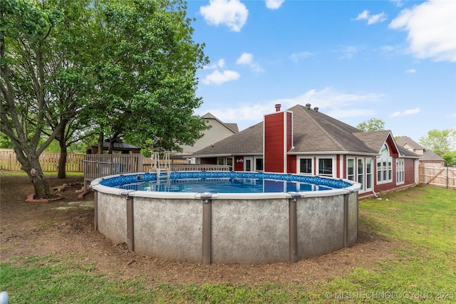 3933 S 199th E Ave, Broken Arrow, OK 74014 - view of pool with a lawn, a fenced in pool, and a fenced backyard