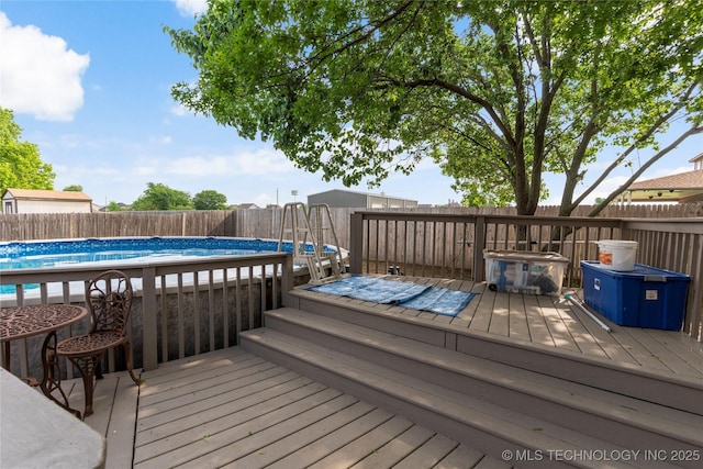 3933 S 199th E Ave, Broken Arrow, OK 74014 - wooden deck with a fenced in pool and a fenced backyard