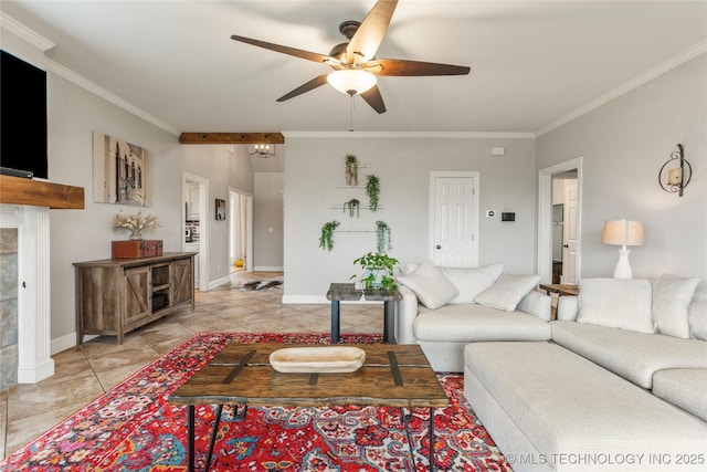 living area with baseboards, ornamental molding, a ceiling fan, and light tile patterned flooring