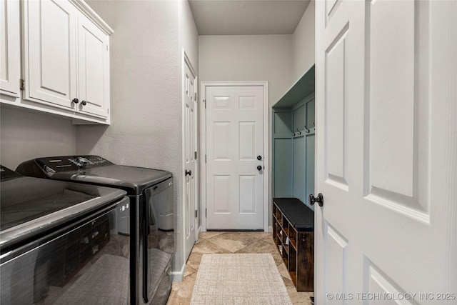 laundry area featuring cabinet space and washing machine and dryer