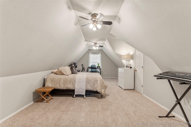 carpeted bedroom with a textured ceiling, ceiling fan, and lofted ceiling
