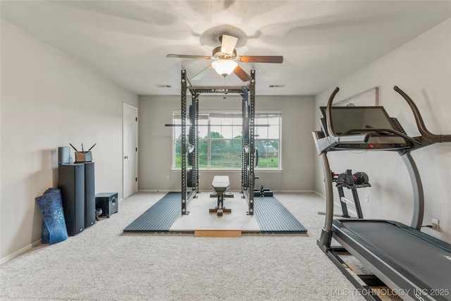 exercise area with visible vents, carpet, ceiling fan, and baseboards