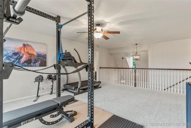 exercise area with carpet floors and ceiling fan