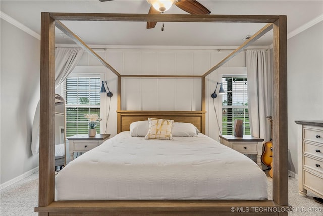 bedroom featuring baseboards, ornamental molding, a ceiling fan, and carpet flooring