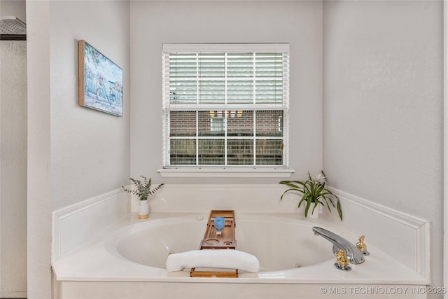 full bath featuring a tub with jets