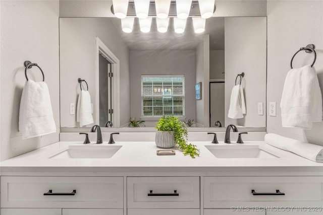 bathroom with double vanity and a sink