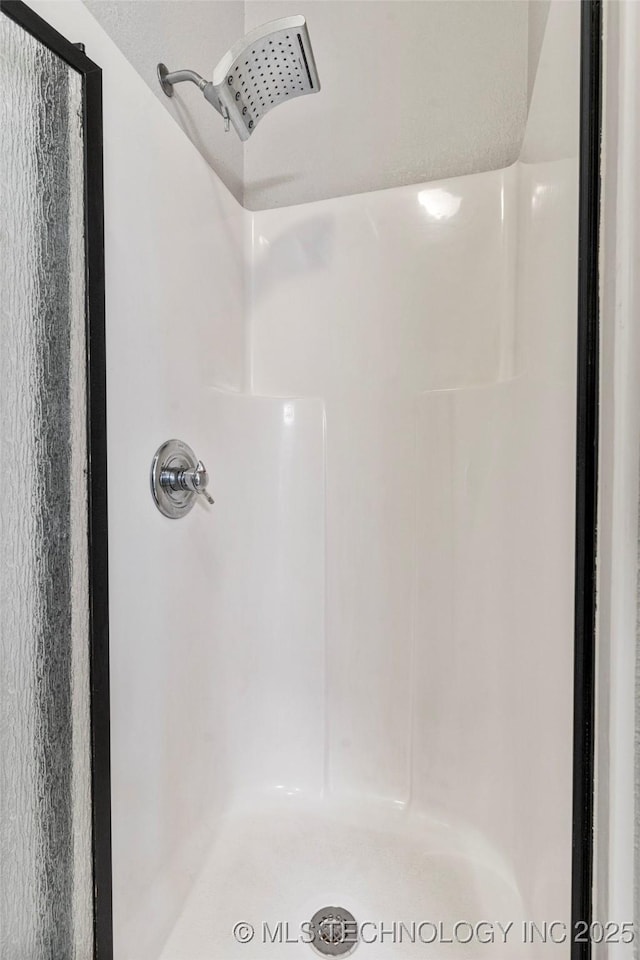 full bathroom with a stall shower