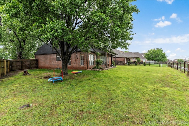 view of yard with a fenced backyard